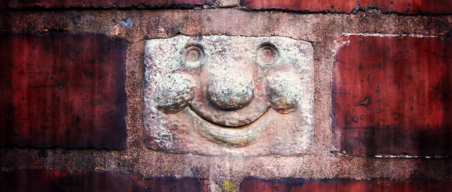 a smiling brick