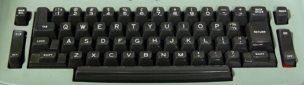 a black IBM Selectric keyboard. The typewriter itself is green.